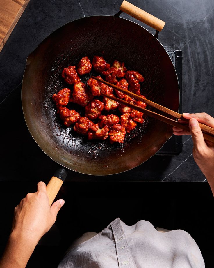 Chef plating a dish in a professional kitchen
